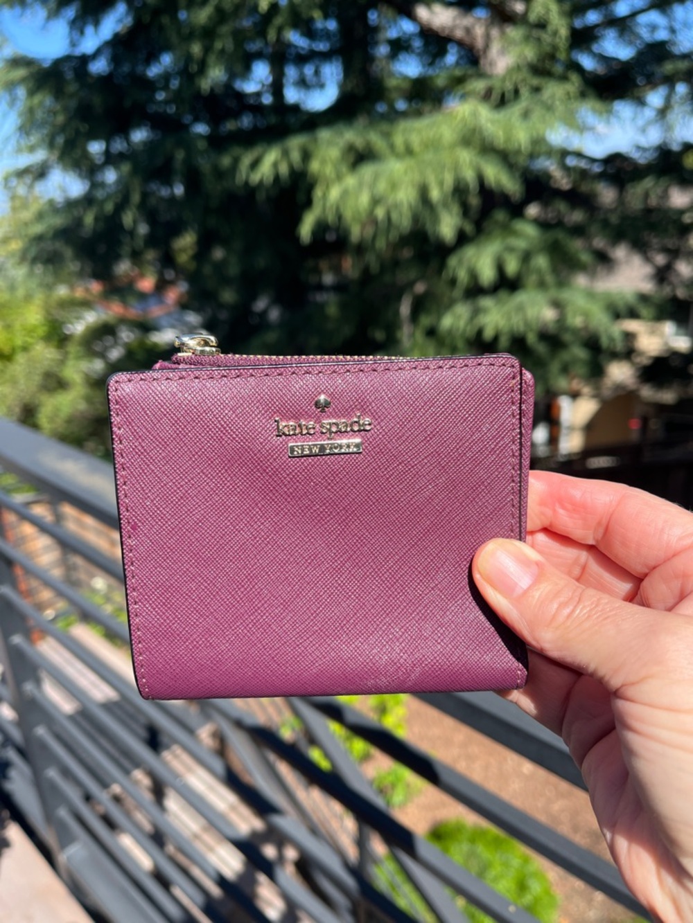 kate spade plum Saffiano zip compact wallet with gold logo